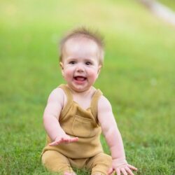 Baby Maverick Lee sitting on grass birthed with help of varicocele surgery | Tennessee Reproductive Medicine | Chattanooga, TN