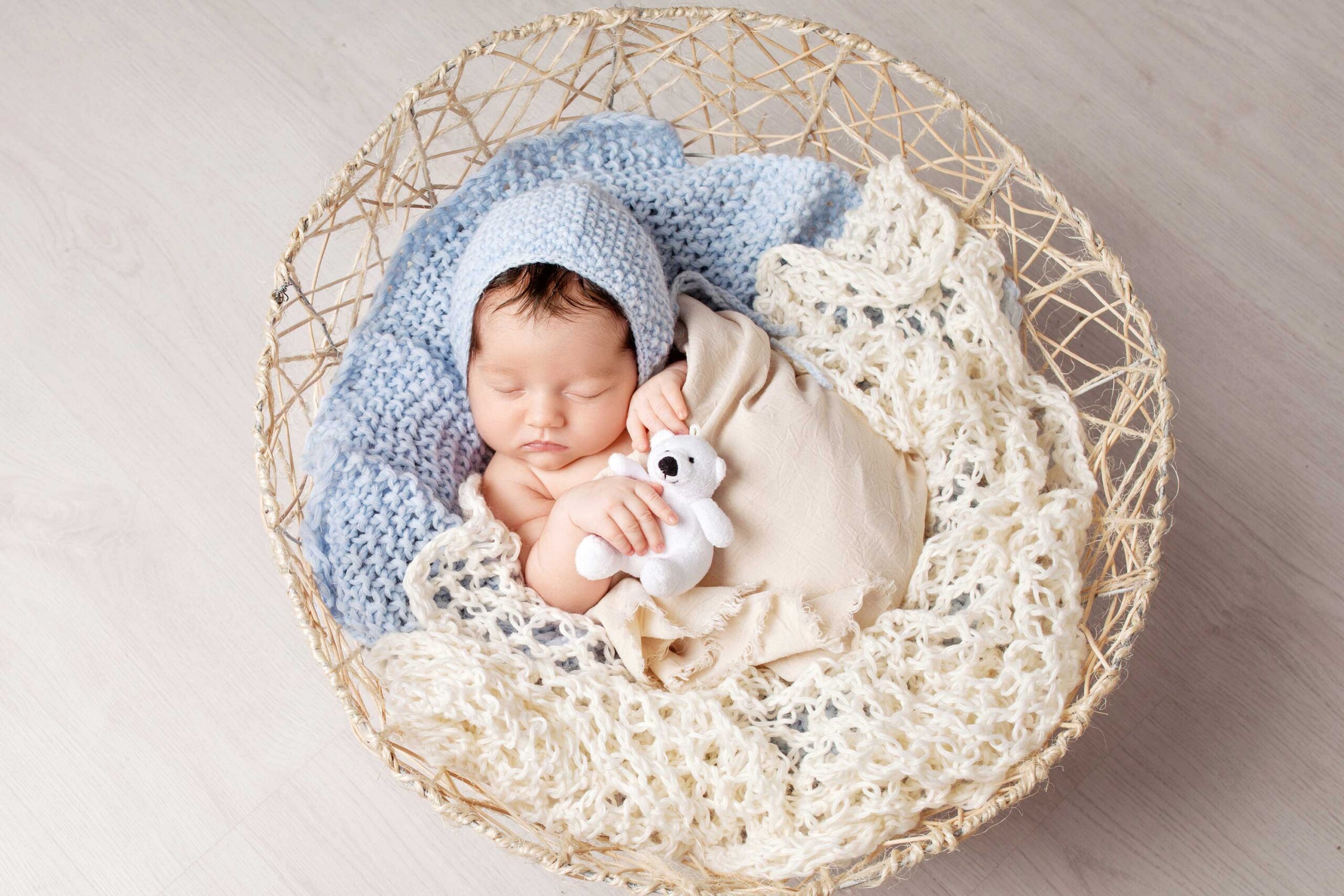 Cute baby in a basket born through mini-IVF, a low IVF cost option | Tennessee Reproductive Medicine | Chattanooga