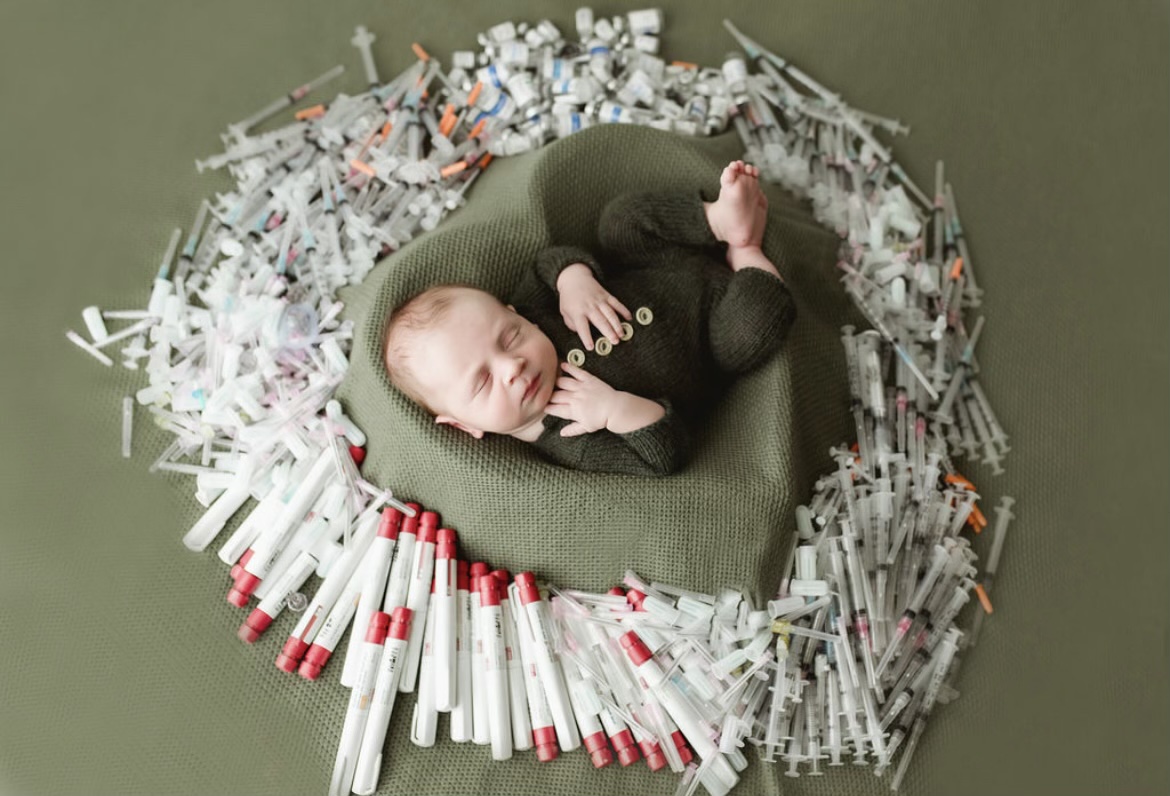Baby Felix, surrounded by IVF injection needles that made Felix’s birth possible after their parents got an infertility second opinion from TRM | Tennessee Reproductive Medicine | Chattanooga