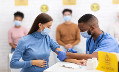 Pregnant woman getting covid vaccine | Tennessee Reproductive Medicine | Chattanooga, TN
