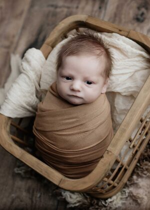 New born baby swaddled in brown, the result of parents IVF journey | TRM | Chattanooga, TN